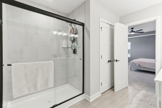 17551 Gruner Way, Westfield, IN 46062 - ensuite bathroom with ceiling fan, a shower stall, and baseboards