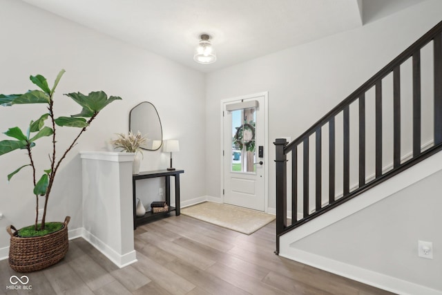 17551 Gruner Way, Westfield, IN 46062 - entrance foyer featuring light wood-style floors, stairway, and baseboards
