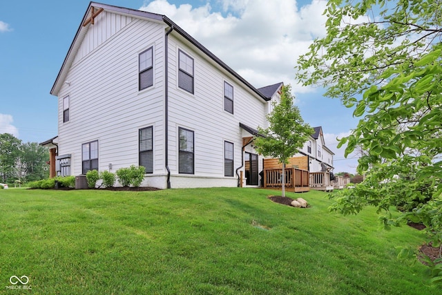 17551 Gruner Way, Westfield, IN 46062 - rear view of house with a lawn, board and batten siding, and a deck