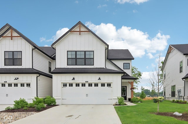 17551 Gruner Way, Westfield, IN 46062 - view of front of home with board and batten siding, a front yard, a garage, and driveway