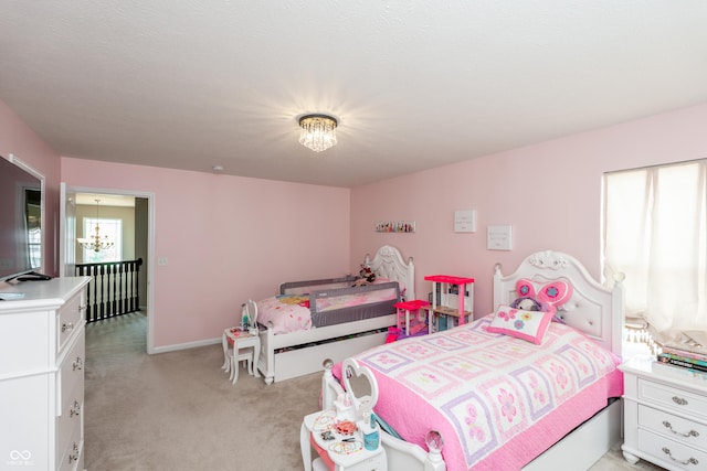1661 Devonshire Ave, Avon, IN 46123 - bedroom with light carpet, multiple windows, a chandelier, and baseboards