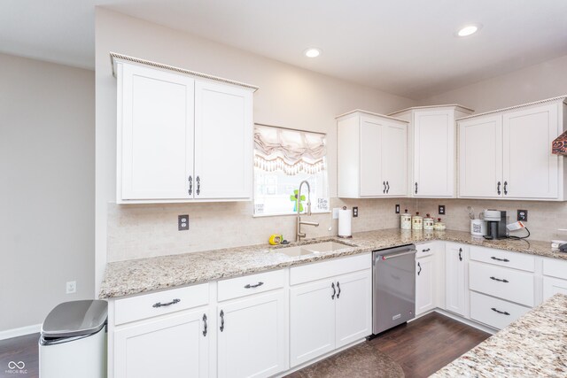 1661 Devonshire Ave, Avon, IN 46123 - kitchen featuring stainless steel dishwasher, a sink, dark wood finished floors, tasteful backsplash, and recessed lighting
