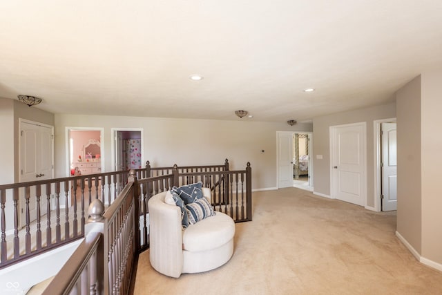 1661 Devonshire Ave, Avon, IN 46123 - sitting room with an upstairs landing, baseboards, light colored carpet, and recessed lighting