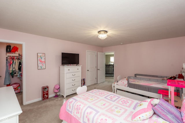 1661 Devonshire Ave, Avon, IN 46123 - bedroom with light carpet, a spacious closet, a closet, and baseboards