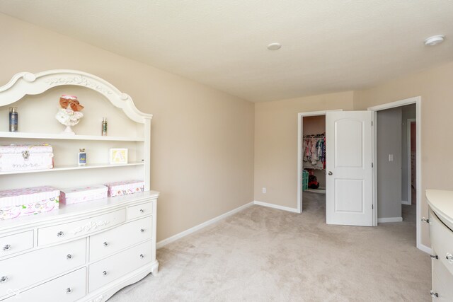 1661 Devonshire Ave, Avon, IN 46123 - bedroom with light colored carpet, a spacious closet, and baseboards