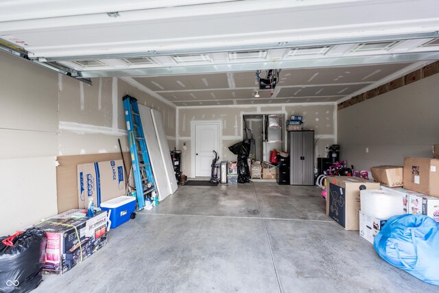 1661 Devonshire Ave, Avon, IN 46123 - garage featuring a garage door opener