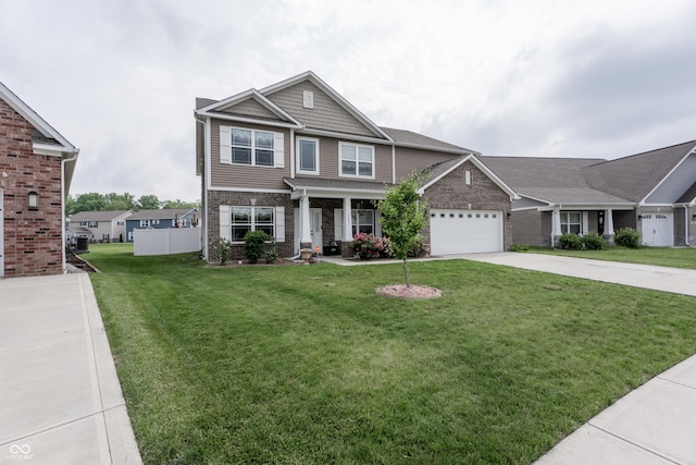 1661 Devonshire Ave, Avon, IN 46123 - craftsman-style home featuring driveway, a front lawn, a garage, and brick siding