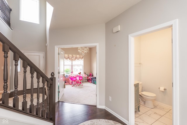 1661 Devonshire Ave, Avon, IN 46123 - foyer with a chandelier, stairway, and baseboards