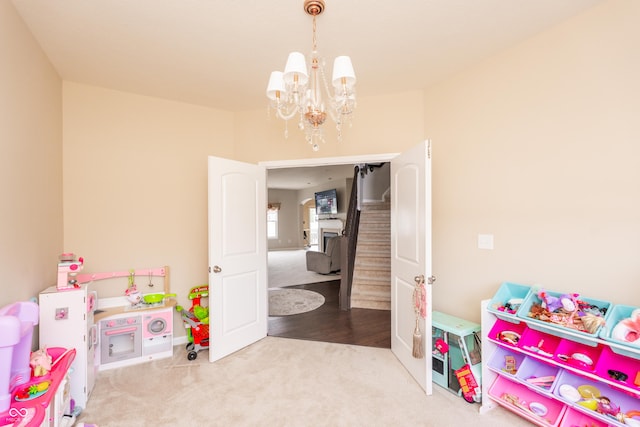 1661 Devonshire Ave, Avon, IN 46123 - recreation room featuring carpet and a chandelier