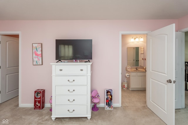 1661 Devonshire Ave, Avon, IN 46123 - bedroom with light carpet, baseboards, a sink, and connected bathroom