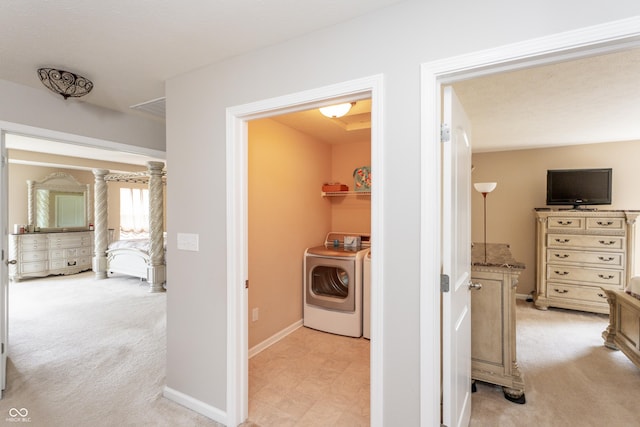 1661 Devonshire Ave, Avon, IN 46123 - hallway featuring light colored carpet, washer and clothes dryer, and baseboards