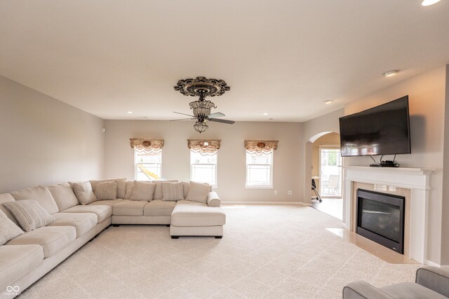 1661 Devonshire Ave, Avon, IN 46123 - living area with arched walkways, light carpet, ceiling fan, plenty of natural light, and recessed lighting