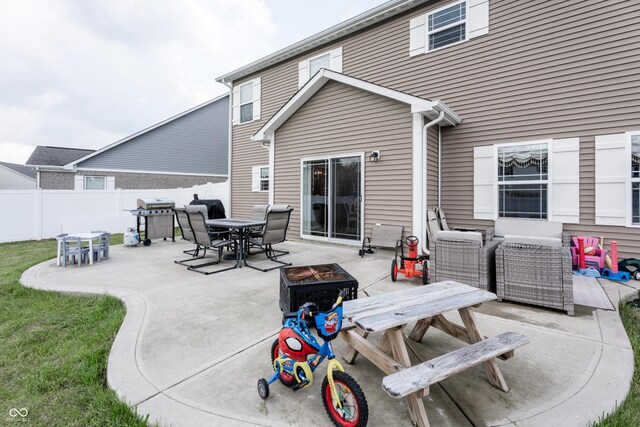 1661 Devonshire Ave, Avon, IN 46123 - back of house featuring outdoor dining space, a patio area, and an outdoor living space with a fire pit