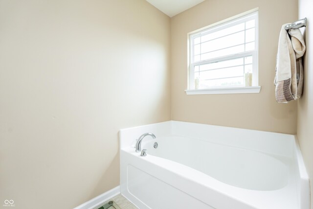 1661 Devonshire Ave, Avon, IN 46123 - full bathroom with a garden tub and baseboards