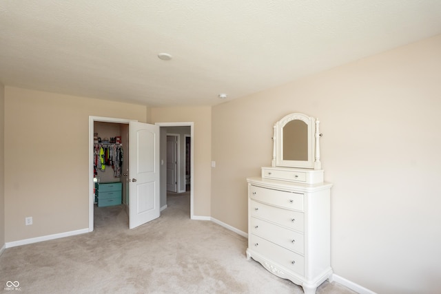 1661 Devonshire Ave, Avon, IN 46123 - bedroom with light carpet, a spacious closet, baseboards, and a closet
