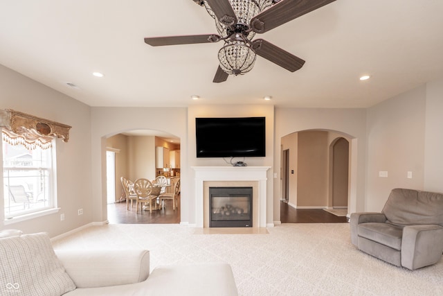1661 Devonshire Ave, Avon, IN 46123 - living area with arched walkways, a ceiling fan, recessed lighting, baseboards, and carpet floors