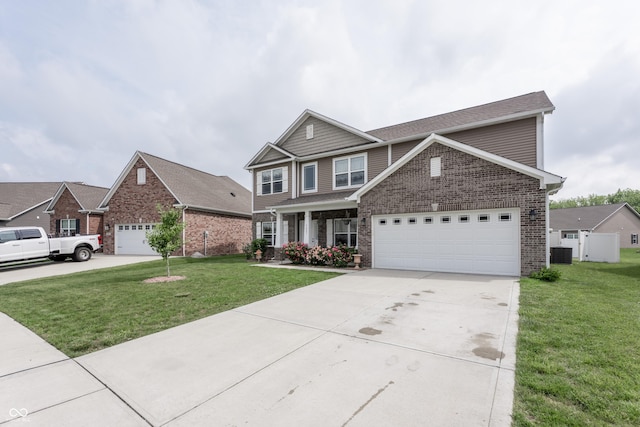 1661 Devonshire Ave, Avon, IN 46123 - view of front of property featuring brick siding, a front lawn, concrete driveway, and central AC