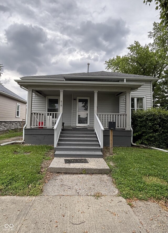 610 N Carver St, Greensburg, IN 47240 - bungalow-style house featuring covered porch and a shingled roof