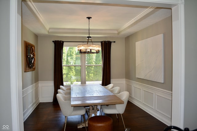 6862 Riverside Way, Fishers, IN 46038 - dining room featuring dark wood-style flooring, a chandelier, a raised ceiling, ornamental molding, and a wainscoted wall