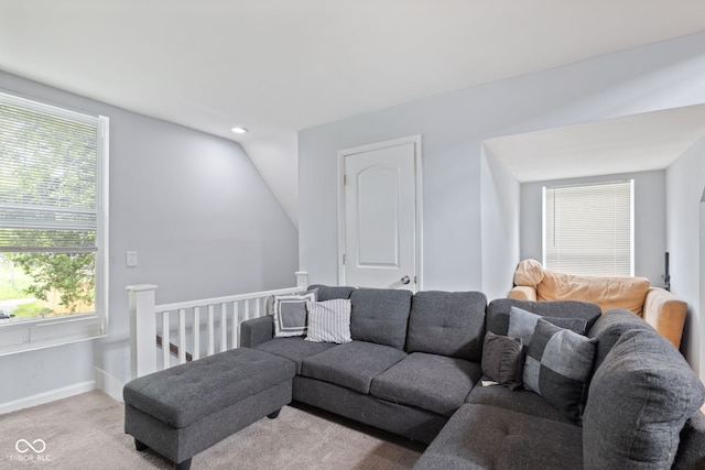 938 N Tuxedo St, Indianapolis, IN 46201 - carpeted living room with lofted ceiling, baseboards, and recessed lighting
