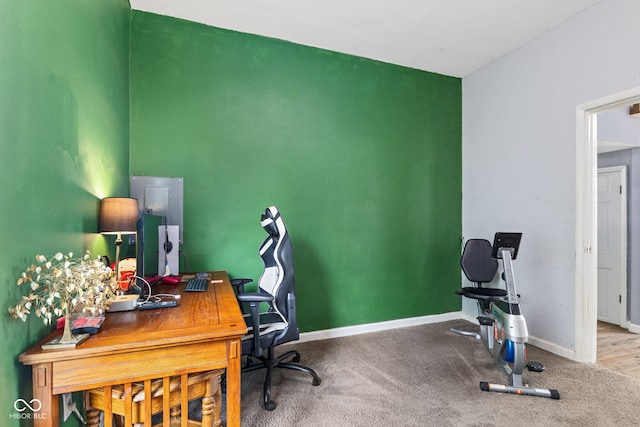 938 N Tuxedo St, Indianapolis, IN 46201 - carpeted home office featuring baseboards