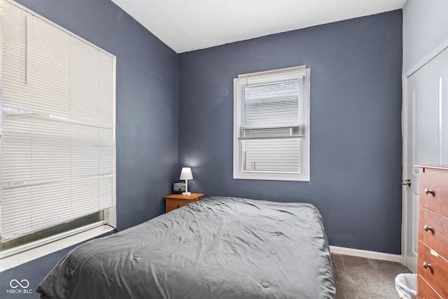 938 N Tuxedo St, Indianapolis, IN 46201 - carpeted bedroom with baseboards
