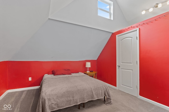 938 N Tuxedo St, Indianapolis, IN 46201 - bedroom featuring lofted ceiling, carpet flooring, baseboards, and a skylight