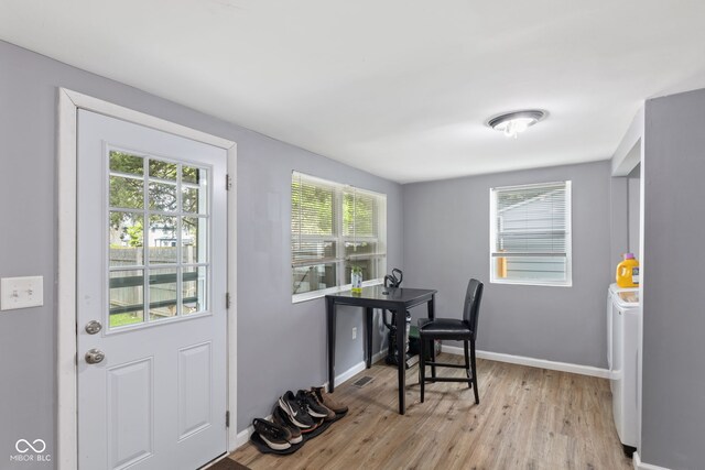 938 N Tuxedo St, Indianapolis, IN 46201 - doorway to outside with light wood-style floors and baseboards