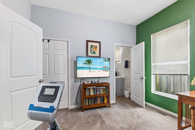 938 N Tuxedo St, Indianapolis, IN 46201 - sitting room with carpet floors and baseboards