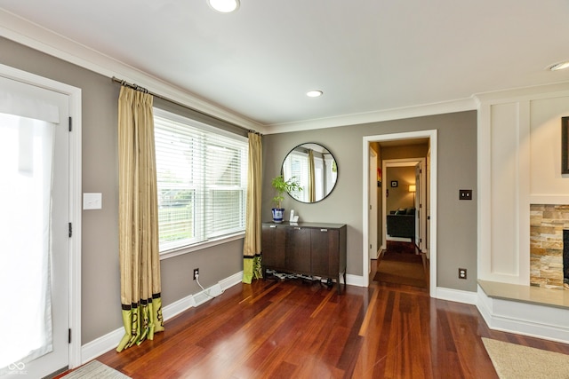 3713 Coventry Way, Carmel, IN 46033 - foyer entrance with wood finished floors, baseboards, a fireplace, ornamental molding, and recessed lighting