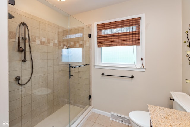 3713 Coventry Way, Carmel, IN 46033 - bathroom featuring toilet, tiled shower, tile patterned floors, vanity, and baseboards