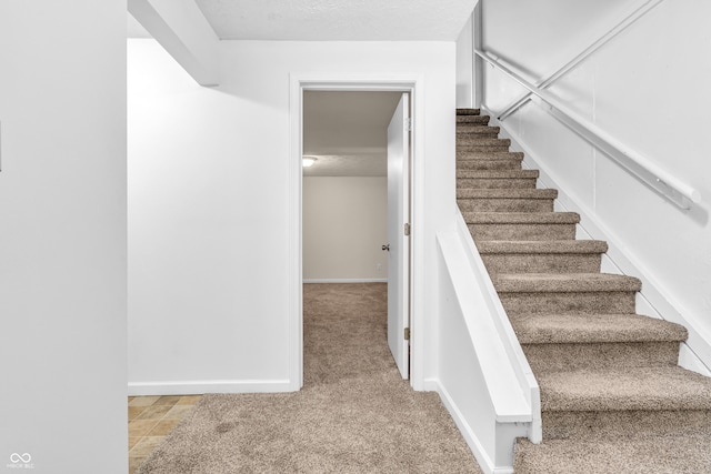 517 E Graham Pl, Bloomington, IN 47401 - stairs featuring carpet floors and baseboards