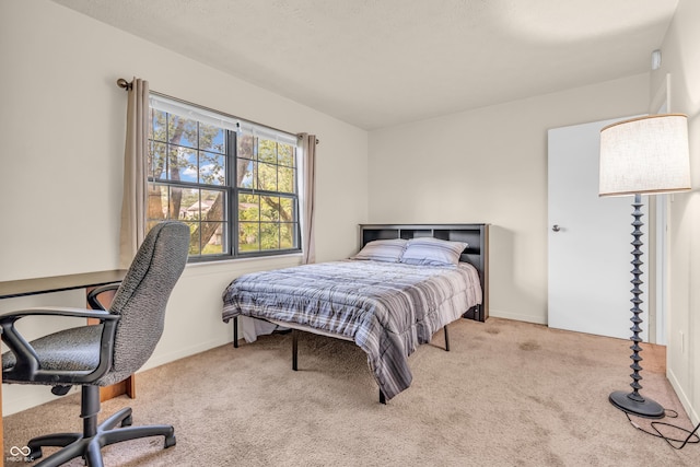 517 E Graham Pl, Bloomington, IN 47401 - carpeted bedroom featuring an office area and baseboards