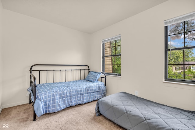 517 E Graham Pl, Bloomington, IN 47401 - carpeted bedroom featuring baseboards
