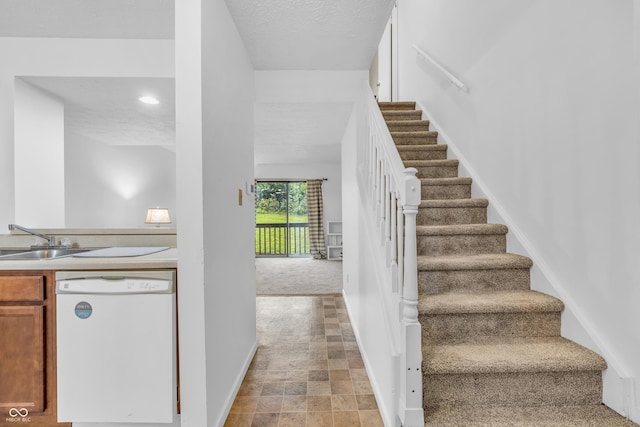 517 E Graham Pl, Bloomington, IN 47401 - staircase featuring baseboards and stone finish floors