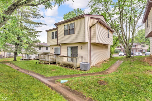 517 E Graham Pl, Bloomington, IN 47401 - rear view of property with cooling unit, a deck, and a yard