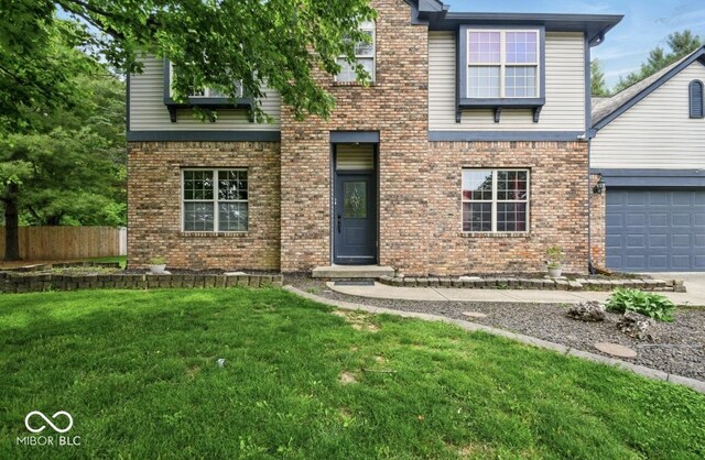 6396 Granny Smith Ln, Avon, IN 46123 - view of front of home with brick siding, concrete driveway, and a garage