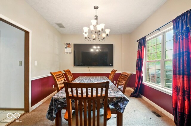 6396 Granny Smith Ln, Avon, IN 46123 - dining room with carpet floors, a chandelier, and baseboards