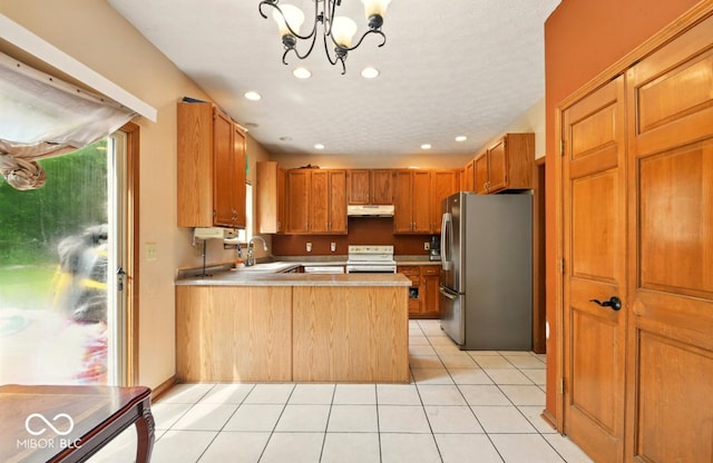6396 Granny Smith Ln, Avon, IN 46123 - kitchen with freestanding refrigerator, white electric range, under cabinet range hood, a peninsula, and a sink