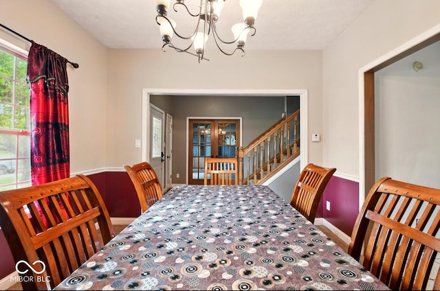 6396 Granny Smith Ln, Avon, IN 46123 - carpeted dining room featuring a chandelier, stairs, and baseboards