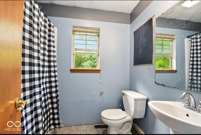 6396 Granny Smith Ln, Avon, IN 46123 - bathroom with a sink, toilet, and a shower with shower curtain