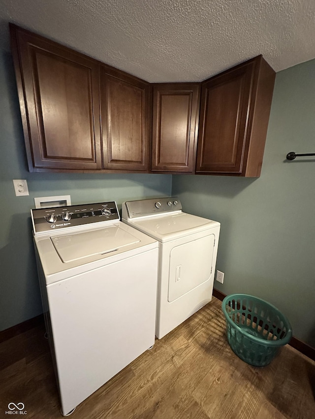 12967 N County Road 825 E, Roachdale, IN 46172 - laundry area with cabinet space, separate washer and dryer, dark wood-style floors, baseboards, and a textured ceiling