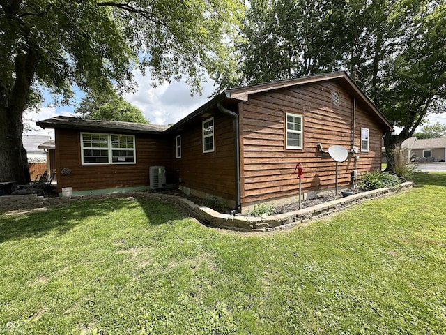 12967 N County Road 825 E, Roachdale, IN 46172 - view of home's exterior with a lawn and central AC unit
