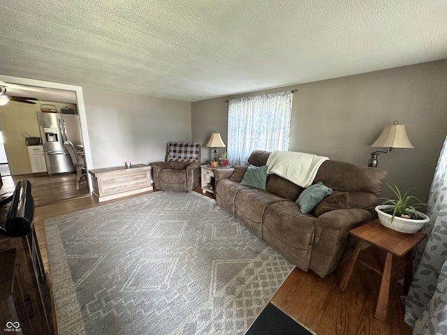 12967 N County Road 825 E, Roachdale, IN 46172 - living area with dark wood-type flooring, a ceiling fan, and a textured ceiling