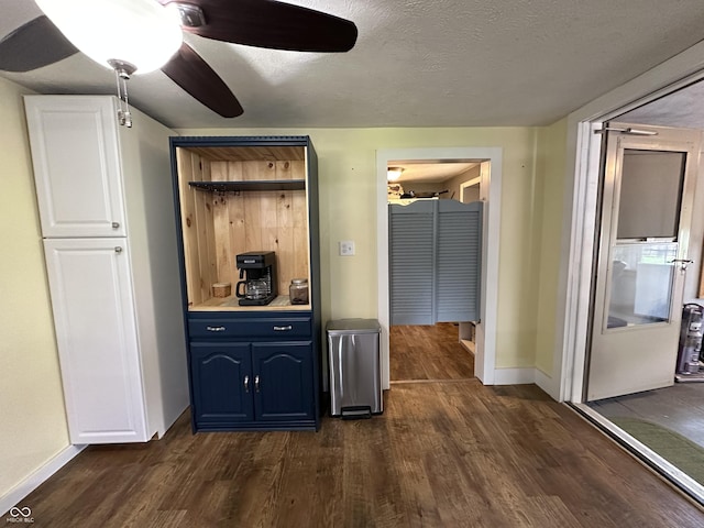 12967 N County Road 825 E, Roachdale, IN 46172 - bar featuring dark wood-style floors, baseboards, ceiling fan, and a textured ceiling
