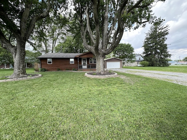 12967 N County Road 825 E, Roachdale, IN 46172 - ranch-style home featuring covered porch, dirt driveway, a front yard, and a garage