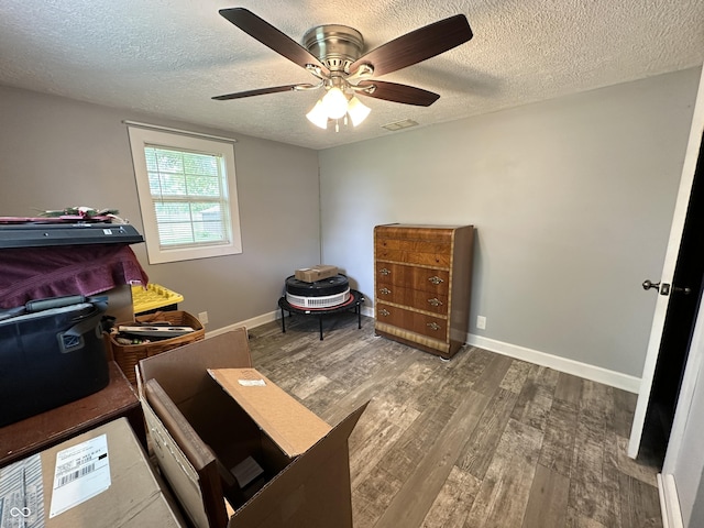 12967 N County Road 825 E, Roachdale, IN 46172 - bedroom with a textured ceiling, wood finished floors, a ceiling fan, and baseboards