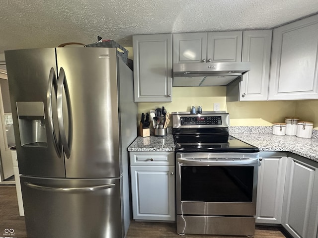 12967 N County Road 825 E, Roachdale, IN 46172 - kitchen with appliances with stainless steel finishes, under cabinet range hood, dark wood finished floors, light stone countertops, and gray cabinetry