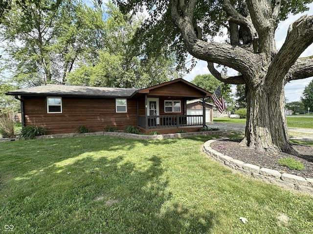 12967 N County Road 825 E, Roachdale, IN 46172 - view of front of home with a front lawn, covered porch, and driveway