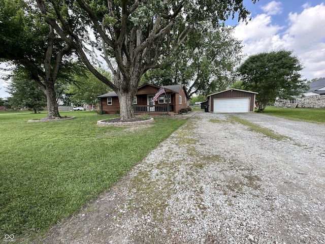 12967 N County Road 825 E, Roachdale, IN 46172 - view of front of house with an outbuilding, a garage, covered porch, and a front yard
